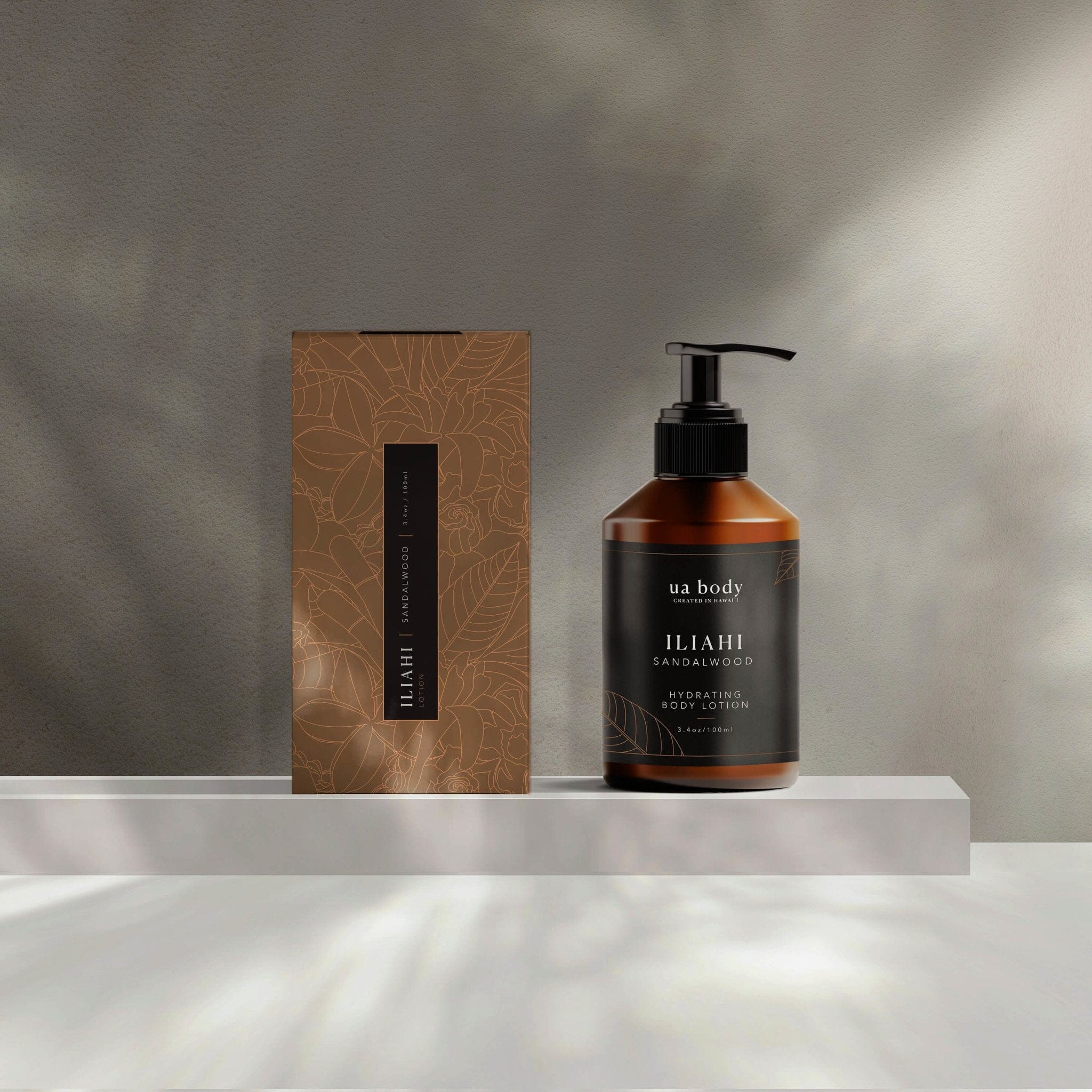 Iliahi Sandalwood Lotion in studio with packaging