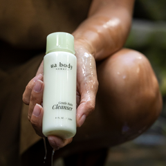 Woman holding Rain Gentle Face Cleanser