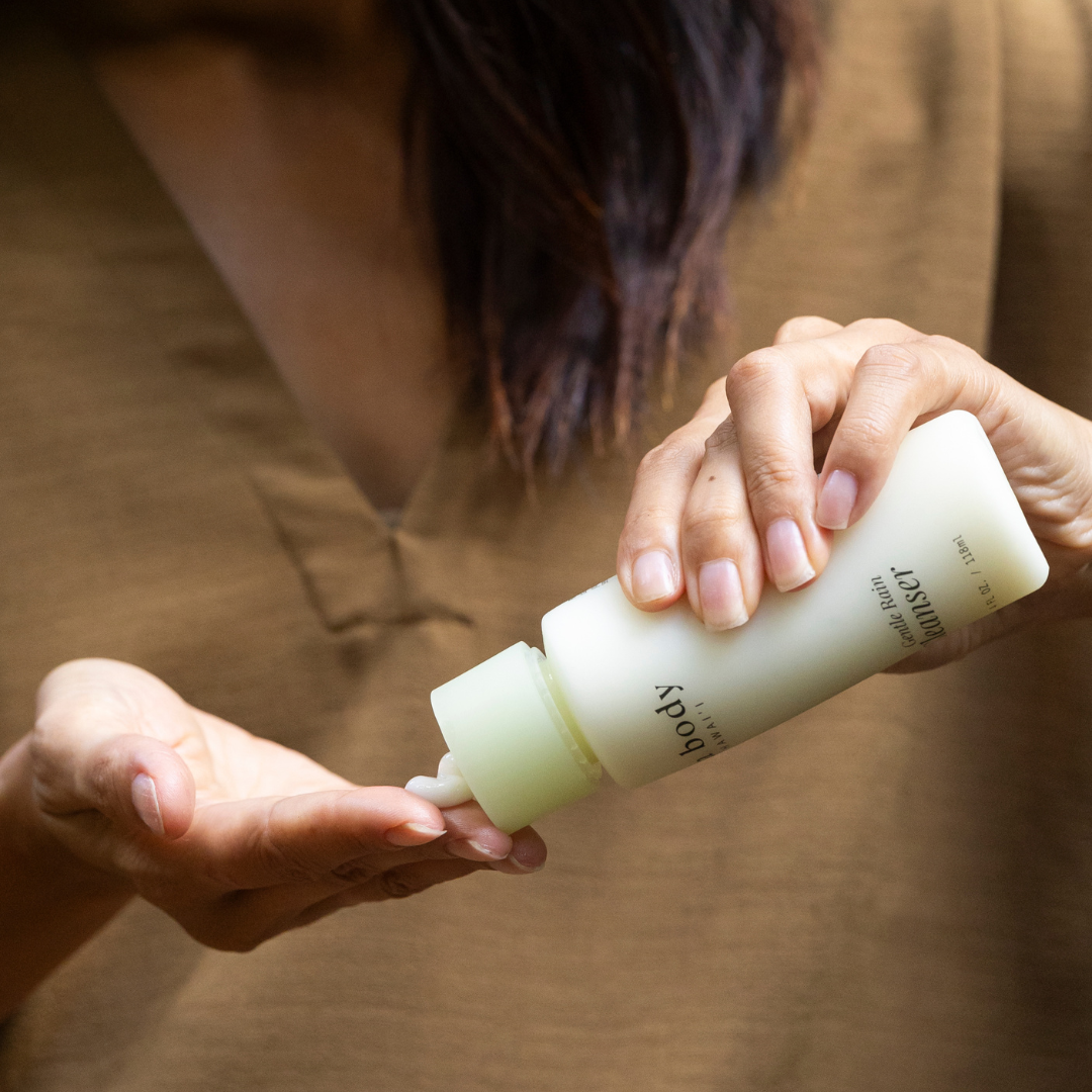 Woman squeezing cleanser into her hands